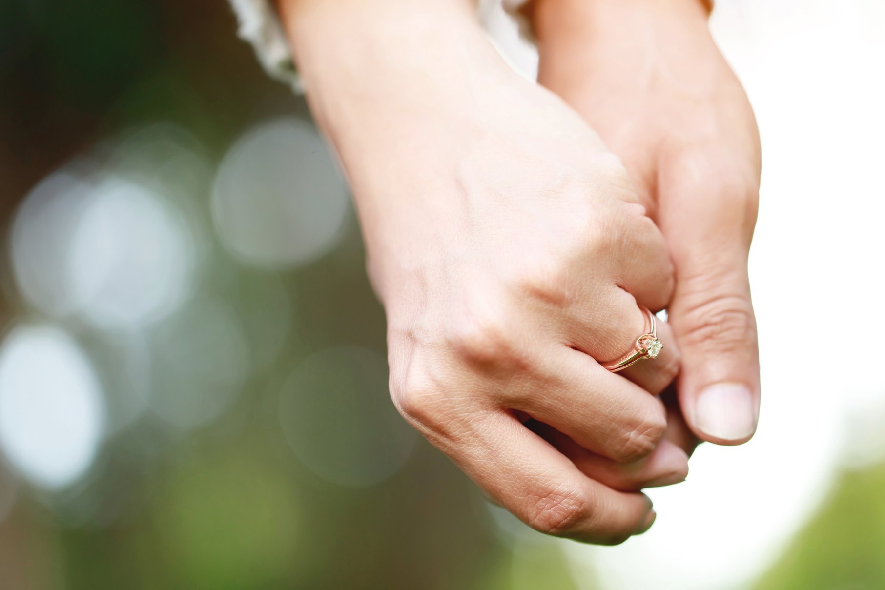 Engaged Couple Holding Hands 